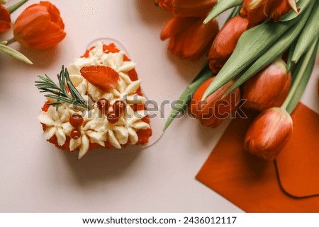Beautiful festive background with place for text, tulips and sweets.