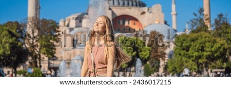 BANNER, LONG FORMAT Woman enjoy beautiful view on Hagia Sophia Cathedral, famous islamic Landmark mosque, Travel to Istanbul, Turkey. Sunny day architecture and Hagia Sophia Museum, in Eminonu