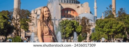BANNER, LONG FORMAT Woman enjoy beautiful view on Hagia Sophia Cathedral, famous islamic Landmark mosque, Travel to Istanbul, Turkey. Sunny day architecture and Hagia Sophia Museum, in Eminonu