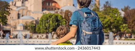 BANNER, LONG FORMAT Father and son Tourists enjoy beautiful view on Hagia Sophia Cathedral, famous islamic Landmark mosque, Travel to Istanbul, Turkey. Traveling with kids concept. Sunny day