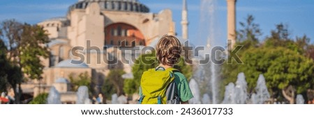 BANNER, LONG FORMAT Boy Tourist enjoy beautiful view on Hagia Sophia Cathedral, famous islamic Landmark mosque, Travel to Istanbul, Turkey. Traveling with kids concept. Sunny day architecture and