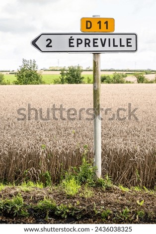 Road sign in rural area indicating direction and distance to Épreville is a commune in the Seine-Maritime department in the Normandy region in northern France.