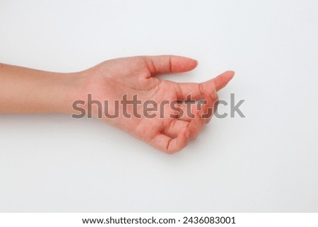 Outstretched female hand isolated on white background.