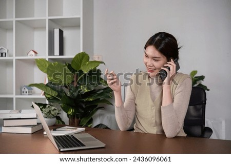 Asian business woman checks and holds online work meeting on laptop Work from home during the holidays