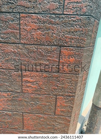 Stunning close-up of Cladding stones or tiles glued onto a wall surface for elegant look with details Ultrahd hi-res jpg stock image photo picture selective focus vertical background side ankle view 
