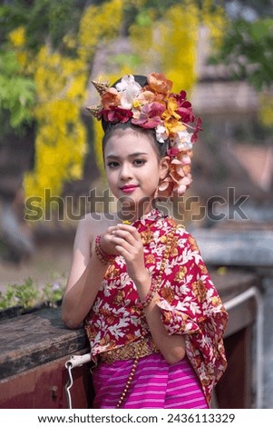 Portrait young Asia woman and girl in Thai Traditional Dress holding silver bowl to celebrate Songkarn festival  Culture lifestyle of people on Thailand New Year. Playing with water splashing Songkran