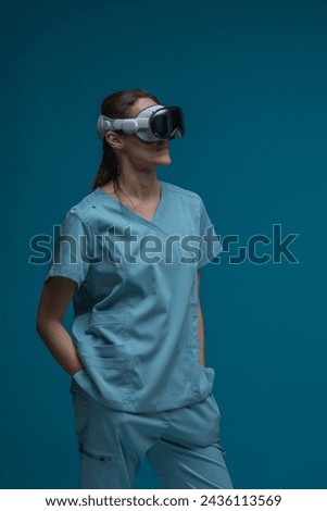 Smiling healthcare professional using her spatial computer headset, exploring the possibilities augmented reality in a medical context Royalty-Free Stock Photo #2436113569