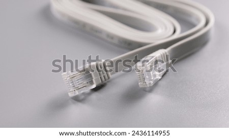 Closeup of rj45 cable on gray background. internet connection concept