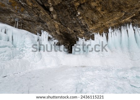 Coast of lake Baikal in winter, the deepest and largest freshwater lake by volume in the world, located in southern Siberia, Russia Royalty-Free Stock Photo #2436115221