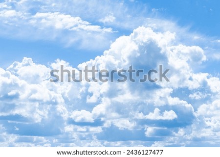 blue background of the summer sky with clouds.