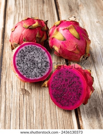 Pitayas or Dragon fruits over wooden table.
