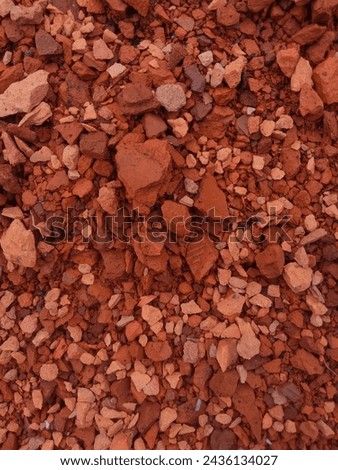 Reddish brown gravel soil texture Royalty-Free Stock Photo #2436134027