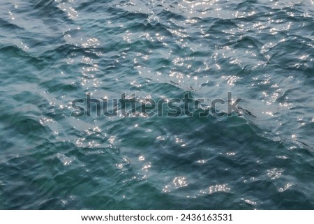 Emerald green sea texture background Glittering reflected in the sunlight Look and feel refreshed.