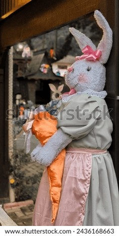 easter bunny holding a carrot