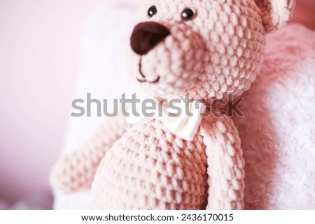 Teddy bear. Pink knitted bear.Toys