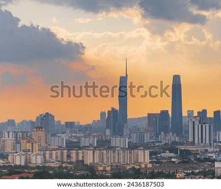 Kuala Lumpur city view during dusk overlooking the city skyline at sunset from day to night in Malaysia.
