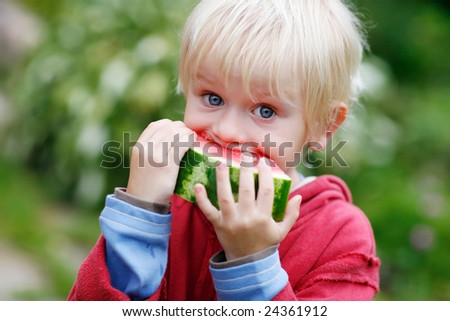 Picture of young boy and a slice of watermelon with big bite marks