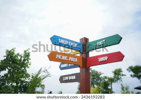 colorful signposts at a zoo