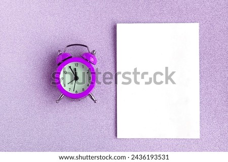 Alarm clock and white mockup blank on color background. Minimal concept
