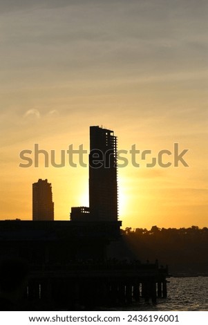 Silhouette picture of Tall buildings and mountains in the evening sun is about to set,View of Pattaya city in Silhouette style.