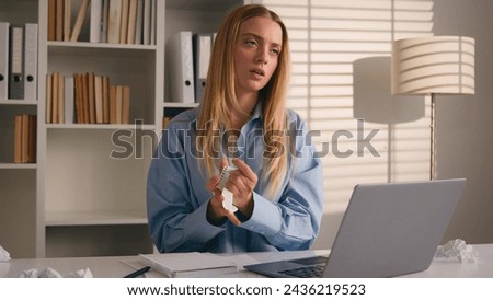 Caucasian businesswoman write business idea paperwork writing stress with mistake lack of inspiration rips sheet of paper from notebook throw away sad unhappy woman writer student girl crumpling notes Royalty-Free Stock Photo #2436219523