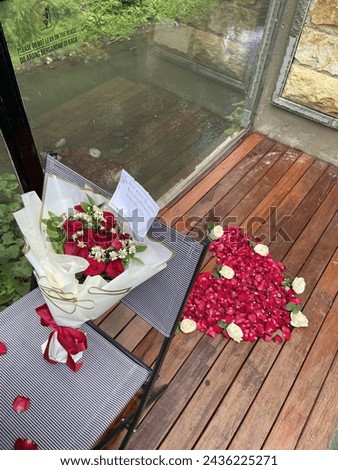 Romantic Setting with Bouquet and Heart made of Petals Royalty-Free Stock Photo #2436225271