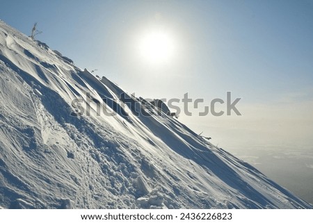 Mt Yotei steep ascent in Snow to top Views sun panorama Hokkaido Japan. High quality photo Royalty-Free Stock Photo #2436226823