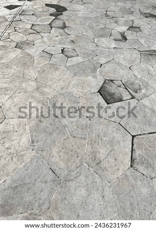 Stone outdoor ground flooring side walk pavement walk way exterior photography isolated on vertical ratio background. Stone material texture.