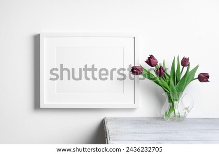 Horizontal picture frame mockup with tulips flowers