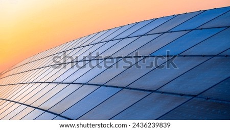 Horizontal banner with solar cell panels or photo-voltaic cell modules mounted in a frames on a hill in Germany. Sunlight as a source of energy to generate direct current electricity. Renewable energy
