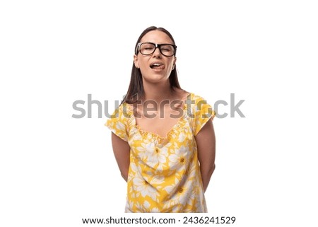 European woman with straight flowing black hair makes a face and flirts