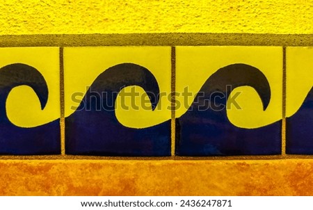 Beautiful colorful tiles with pictures in Zicatela Puerto Escondido Oaxaca Mexico.