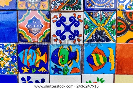 Beautiful colorful tiles with pictures in Zicatela Puerto Escondido Oaxaca Mexico.