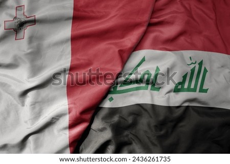 big waving national colorful flag of iraq and national flag of malta. macro