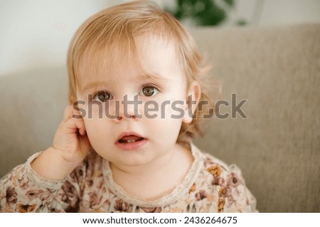 charming little girl looking at camera