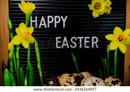 Easter composition Quail eggs Text Happy Easter on blackboard Yellow daffodils narcissus Spring holiday concept Greeting card Front view