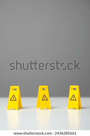 Perimeter warning signs. Be careful. No no zone. Overcome obstacles and forge ahead towards goals. Avoid trouble. Adaptability. Find a way through dangers and risks. Find a safe path. Royalty-Free Stock Photo #2436285661