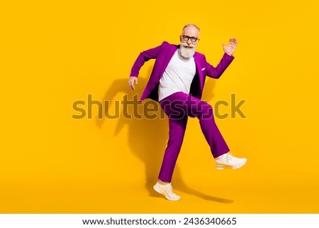 Full size photo of young happy good mood cheerful businessman dancing having fun isolated on yellow color background