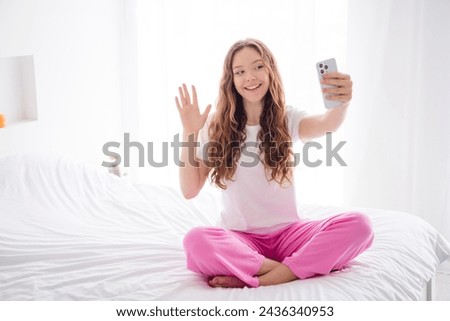 Full size portrait of attractive girl sit comfy white sheets bed hold smart phone take selfie arm wave hi pastime bedroom indoors