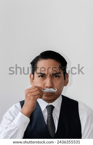 Latin man with mustache serius headshot on white background