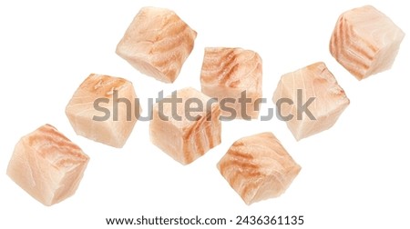 Falling cod fish fillet cubes isolated on white background