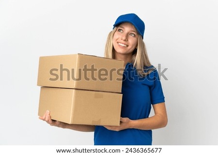 ¬°Young delivery woman isolated on white background thinking an idea while looking up