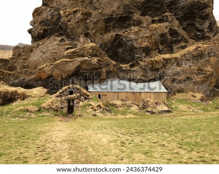 Drangurinn í Drangshlíð is a characteristic tuff rock formation that stands alone on the grazing land of Drangshlíð farm