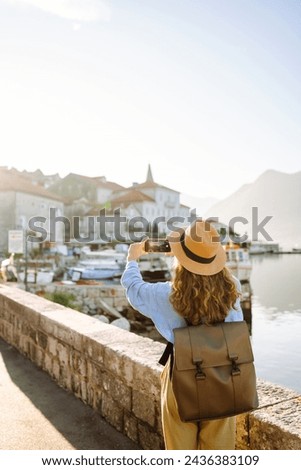 Woman taking picture of amazing landscape  on smartphone during vacation. Lifestyle, travel, tourism, active life.