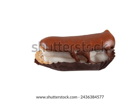 Eclairs with chocolate topping on serving plate. Traditional french eclairs with chocolate. Mini vanilla eclairs with chocolate frosting. Royalty-Free Stock Photo #2436384577
