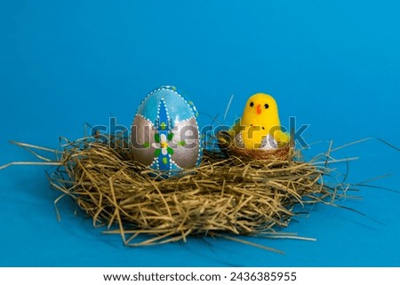Easter Egg on Blue Background. Religious symbol