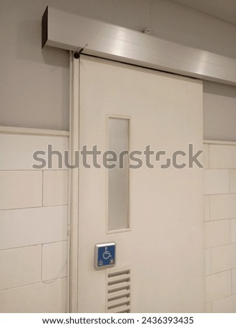 Sliding toilet door handle frame
