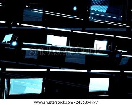 Close-up of modern building interior. Structural wall of abstract futuristic hi-tech architecture. Geometric background with linear pattern, panels, stripes and parallel lines. Sky in windows. Royalty-Free Stock Photo #2436394977