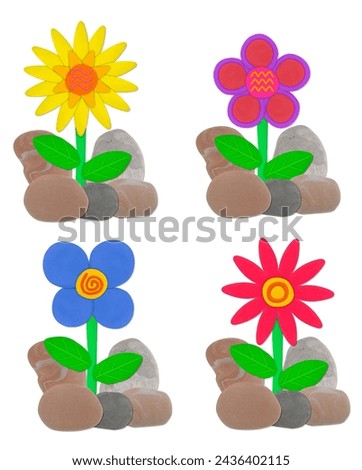 colorful flower and stone made from plasticine on white isolated background