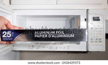 Demonstrating picture of the danger of a food foil in microwave can start a fire